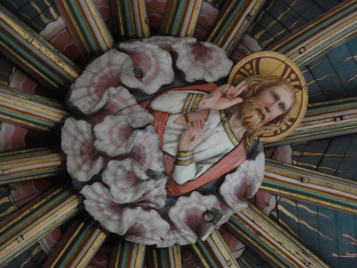 Christ, carved and painted on the boss at the centre of the lantern vault Christ, carved and painted on the boss at the centre of the lantern vault