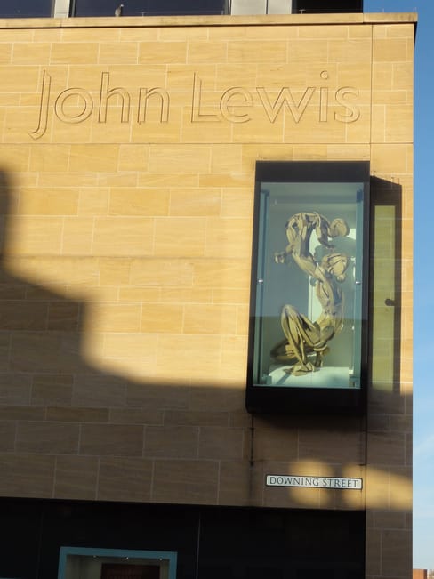 A sculpture on the wall of John Lewis, featured in the sculpture trail.