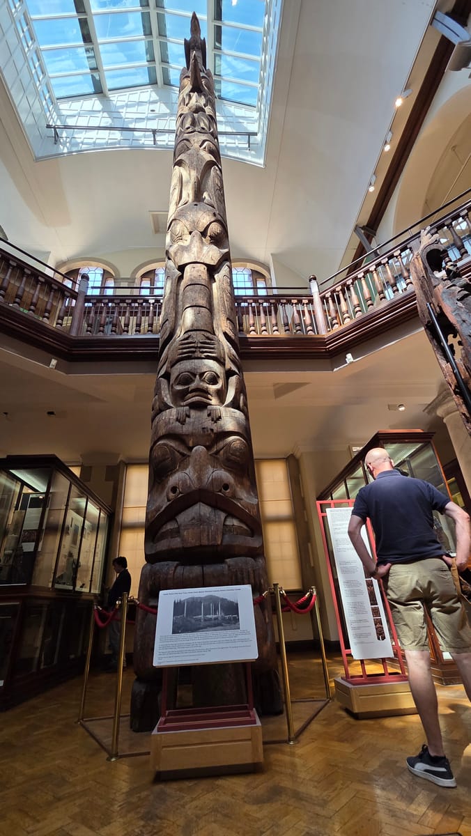 The Haida totem pole from Tanu, from the floor of the hall The Haida totem pole from Tanu, from the floor of the hall